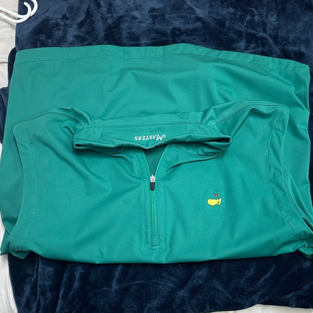Masters Green 3/4 zip sleeve less pullover.
